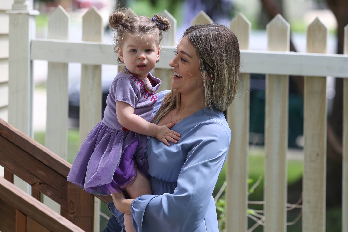 Kristin Dziuban Walls, who suffered a stroke on Thanksgiving day last year, plays with her Mila, 1, in her backyard on Friday, May 10, 2024 in Morris.