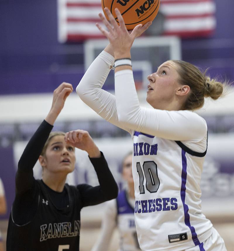 Dixon’s Presley Lappin looks to put up a shot against Kaneland’s Daniela Ridolfi (left) and Lillyana Crawford Wednesday, Dec. 10, 2025.