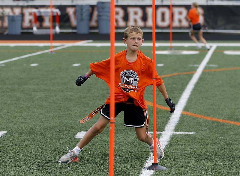 Greyson Jett  runs through a drill during the Chicago Bears Mini Monsters Flag Football Camp on Wednesday, July 16, 2025. at McCracken Field in McHenry.