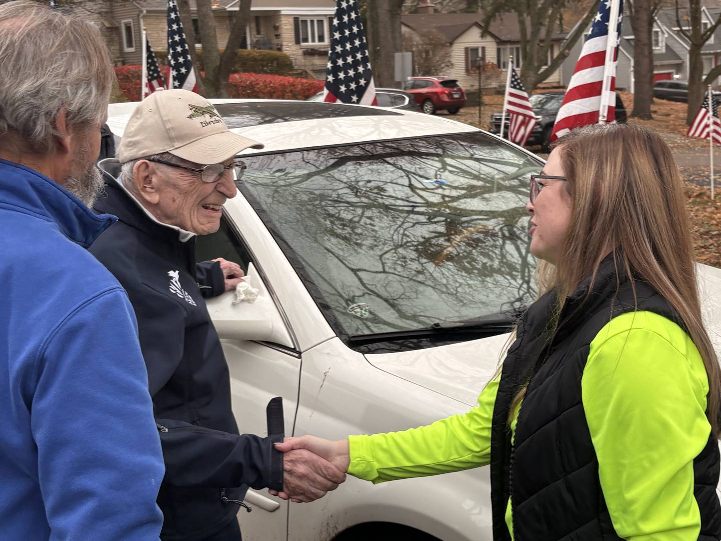 World War II veteran Ed Berthold, left, thanks contractors who help renovate his home to be more accessible on his 106th birthday.