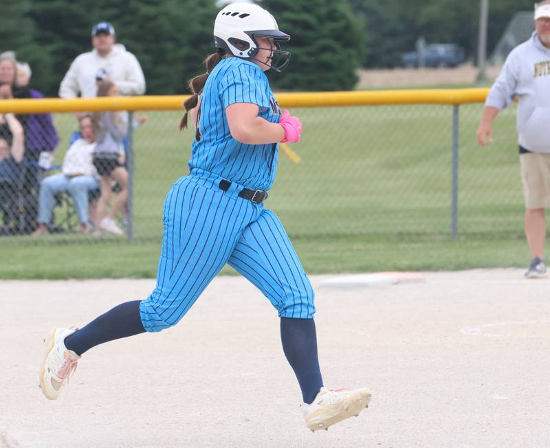 Marquette's Lily Brewer rounds third base to score the teams first run during the Class 1A Regional title game on Friday, May 22, 2026 at Serena High School.