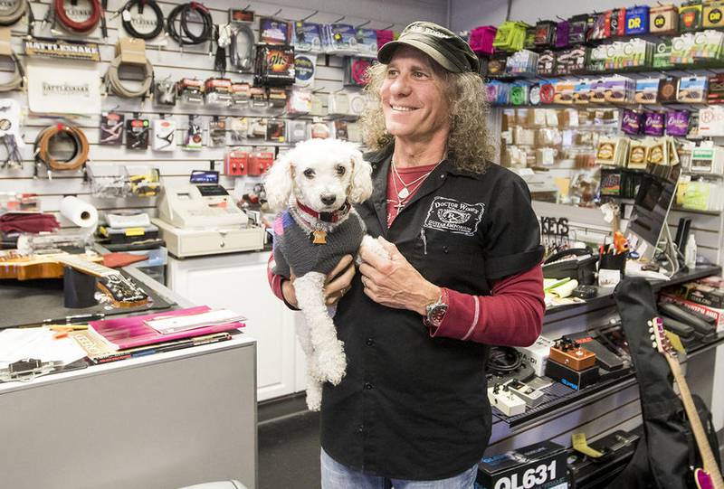 Buddy Wiegelman, owner of Doctor Woods Guitar Emporium, talks with a Northwest Herald reporter at his Fox River Grove shop Wednesday, April 5, 2017.