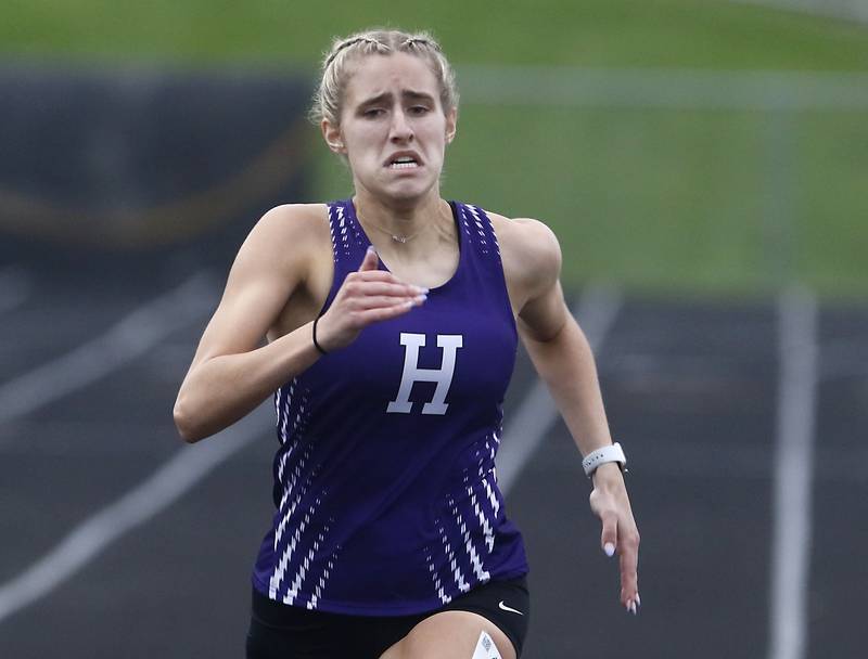 Hampshire’s Ella Perrone wins the 400 meter  race on Thursday, May 2, 2024, during the Fox Valley Conference Girls Track and Field Meet at Jacobs High School in Algonquin.