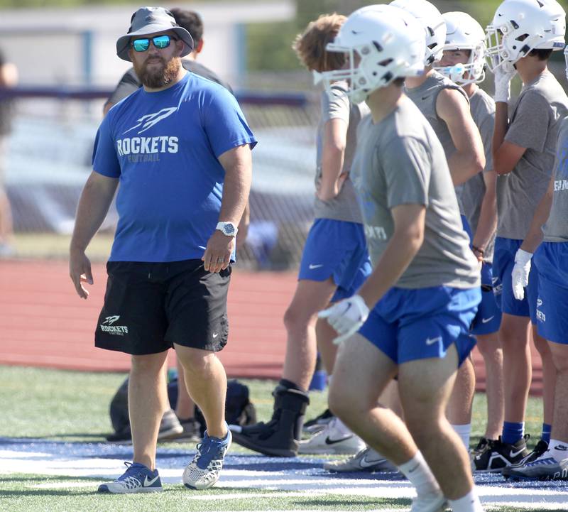 Burlington Central Head Coach Brian Iossi walks the sideline during a 7 on 7 tournament at St. Charles North High School on Thursday, June 30, 2022.
