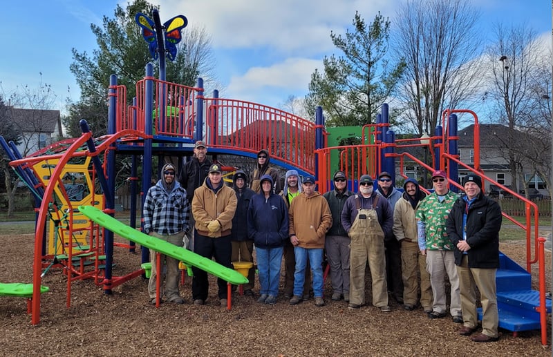 Braving the chilly December temperatures, Yorkville parks department staff and city officials celebrate the re-opening of Rice Park, with all new inclusive playground equipment, on Dec. 3, 2024.