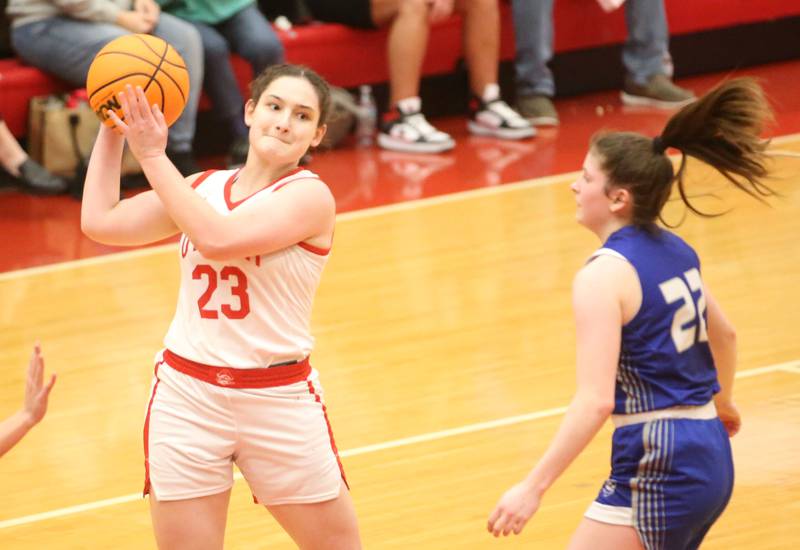 Ottawa's Mary Stisser looks to pass the ball around Princeton's Camryn Driscoll on Monday, Feb. 3, 2025 in Kingman Gymnasium at Ottawa High School.