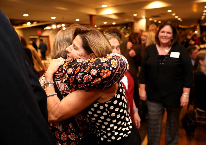 Kristie Dienst is congratulated by friends and family after being announced as the 2023 Geneva Chamber of Commerce Wood Award winner during the chamber’s annual dinner and awards at Riverside Receptions in Geneva on Thursday, Nov. 2, 2023.