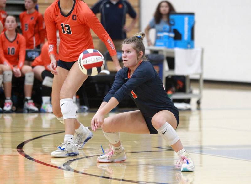 Oswego’s Alexis Terrazas (1) digs for the ball during a game Wednesday, Sept. 18, 2024 at St. Charles North.