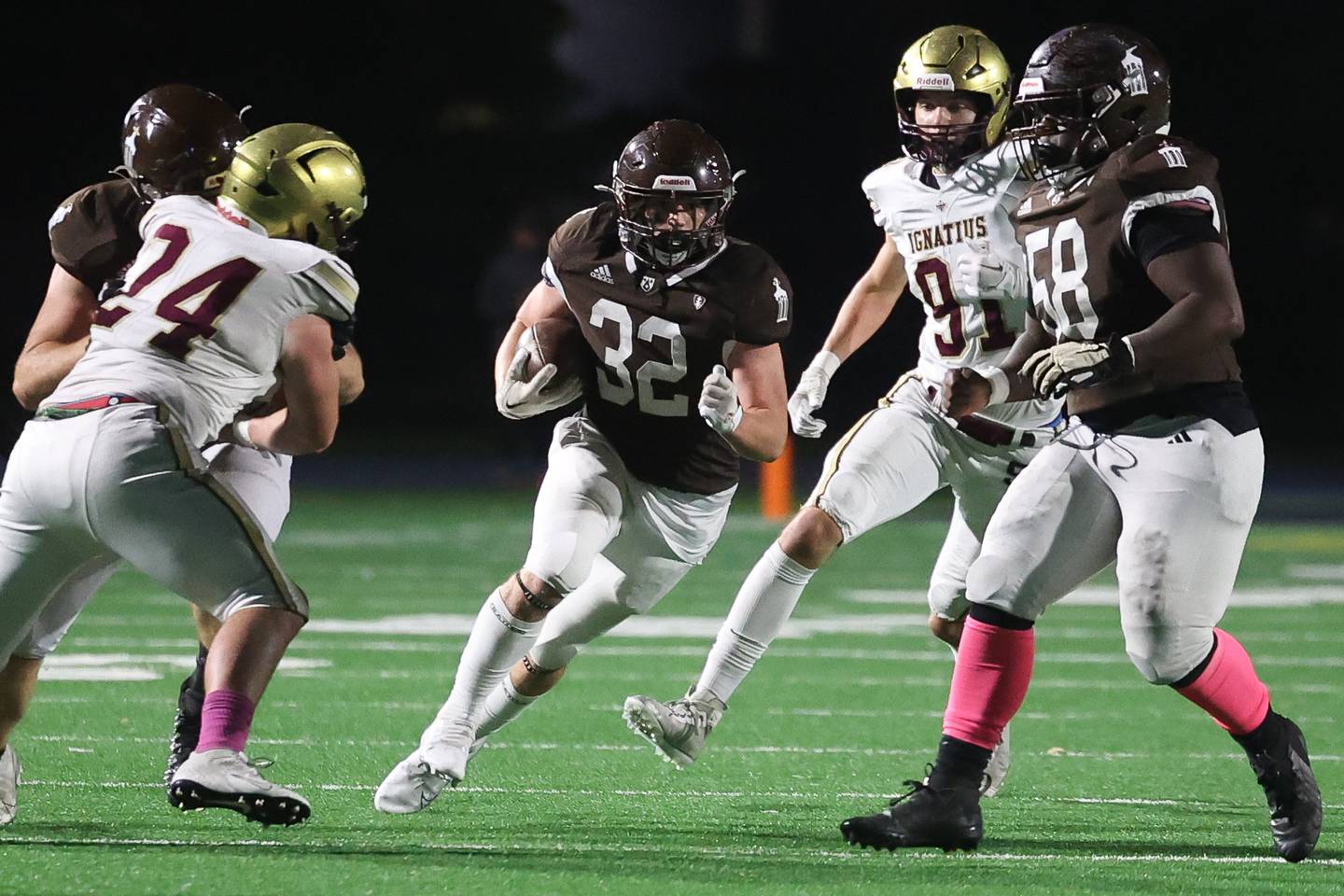 Joliet Catholic’s Vince Bremmer runs after a catch against St. Ignatius on Friday, Oct. 20 in Joliet.