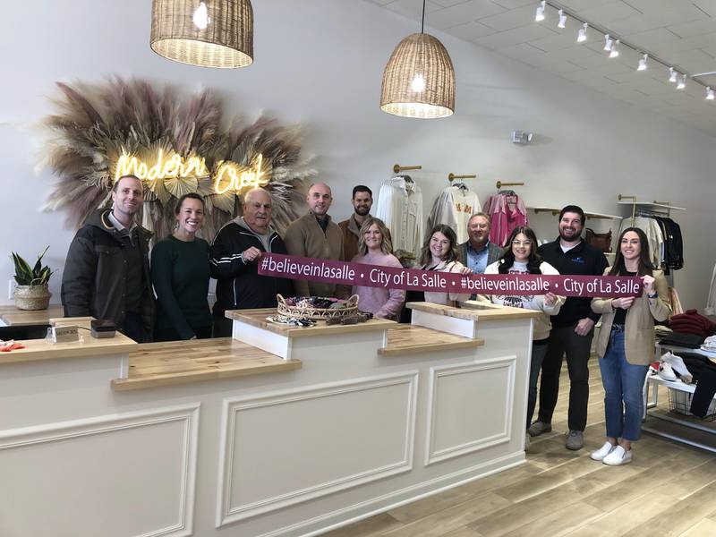 City officials, community members and owners of Modern Creek Boutique held a ribbon-cutting ceremony to celebrate the boutique's grand opening on Friday, Feb. 3, 2023.