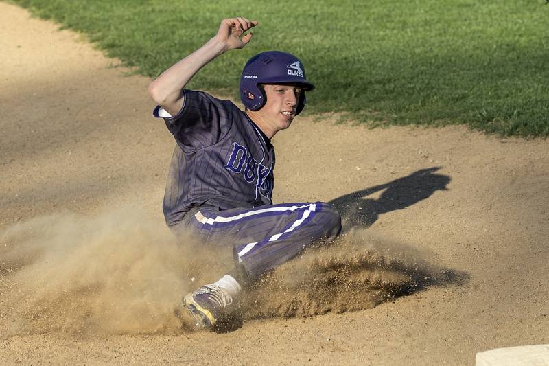 Dixon’s James Simpson slides in safely at third base against Rock Falls Tuesday, April 29, 2025.