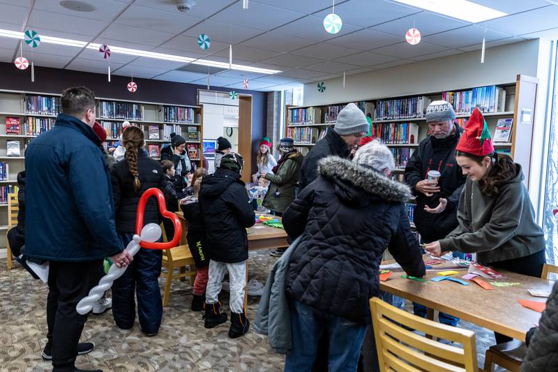 Attendees make crafts at the White Oak Library District’s Lockport Branch during Lockport’s Christmas in the Square festivities on Nov. 29, 2025.