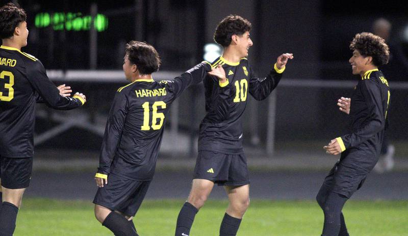 Harvard’s Miguel Mercado (10) is greeted after scoring on an outside shot against Richmond-Burton’s in varsity soccer on Monday, Oct. 7, 2024, at Dan Horne Field on the campus of Harvard High School in Harvard.