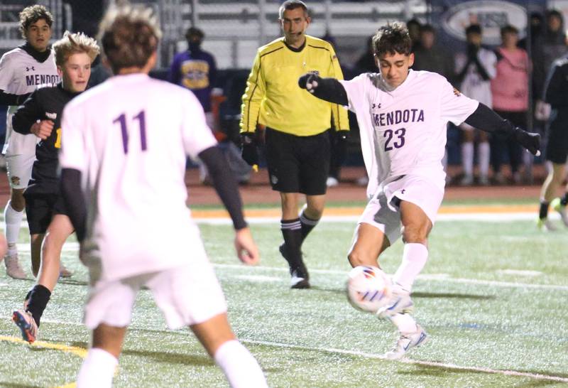 Mendota's Danny Garcia kicks the ball into the box as teammate Cesar Casas moves toward the ball during the Class 1A State semifinal game on Thursday, Nov. 7, 2024 at Hoffman Estates High School.