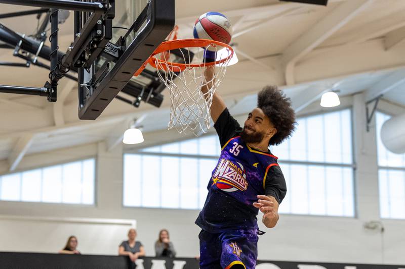 Tyler “Sky-Rise” Cronk (35) of the Harlem Wizards dunks on Wednesday, April 16, 2025 at Woodland High School in Streator.