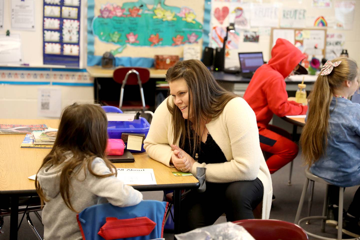 Lauren Banbury works with first graders at Kaneland McDole Elementary School in Montgomery.