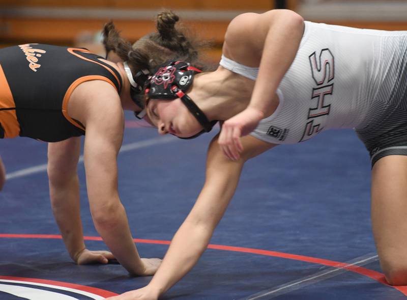 Fulton's Kerby Germann spins around Harlem's Madison Heneks during the 130 pound championship match at the Belvidere Regional on Saturday, Feb. 7, 2026.