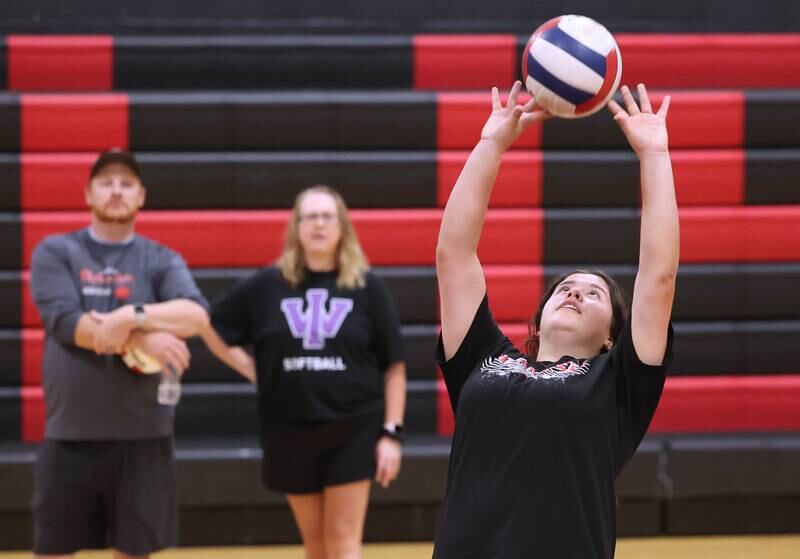 Indian Creek’s Paloma Cardenas sets the ball as her coaches look on during practice Tuesday, Aug. 13, 2024, at the school in Shabbona.