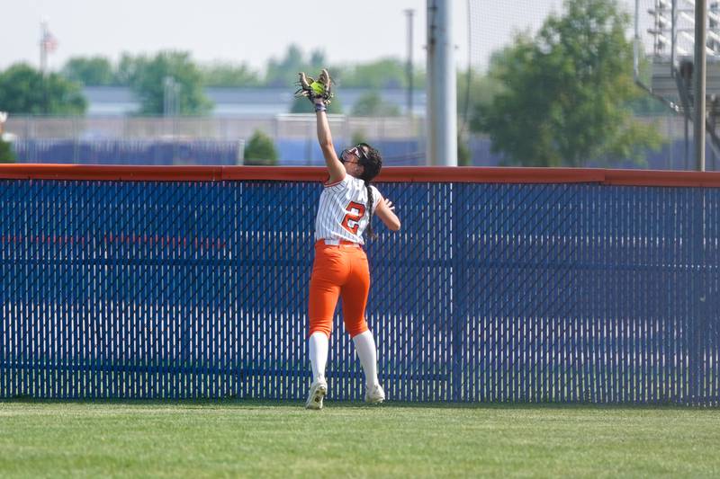 Oswego’s Rhiana Martinez (2) reaches to make the catch on a deep fly-ball for an out against during a Class 4A Oswego Sectional Final game at Oswego High School on Friday, June 6, 2025.