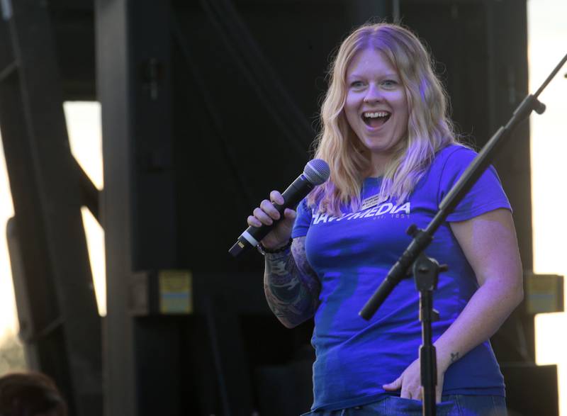 Dani, host of Dani in the morning on Walls 102, a Shaw Local Radio station, gets the crowd fired up before the Trace Adkins concert on Thursday, Aug. 21, 2025 at the Bureau County Fair in Princeton.