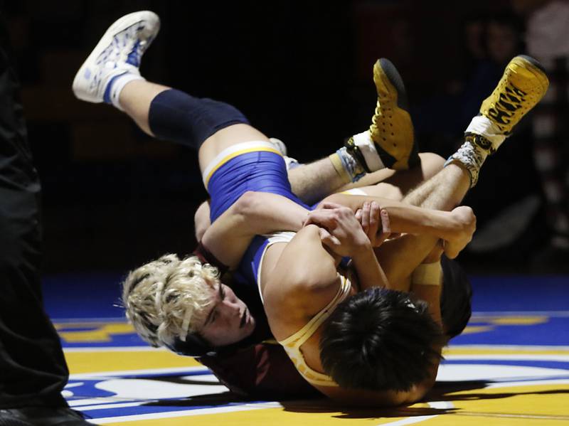 Richmond-Burton’s Dalton Youngs tries to pin Johnsburg’s Kainoa Ancog in the 150-pound match of a Kishwaukee River Conference wrestling meet on Thursday, Jan. 30, 2025, at Johnsburg High School.