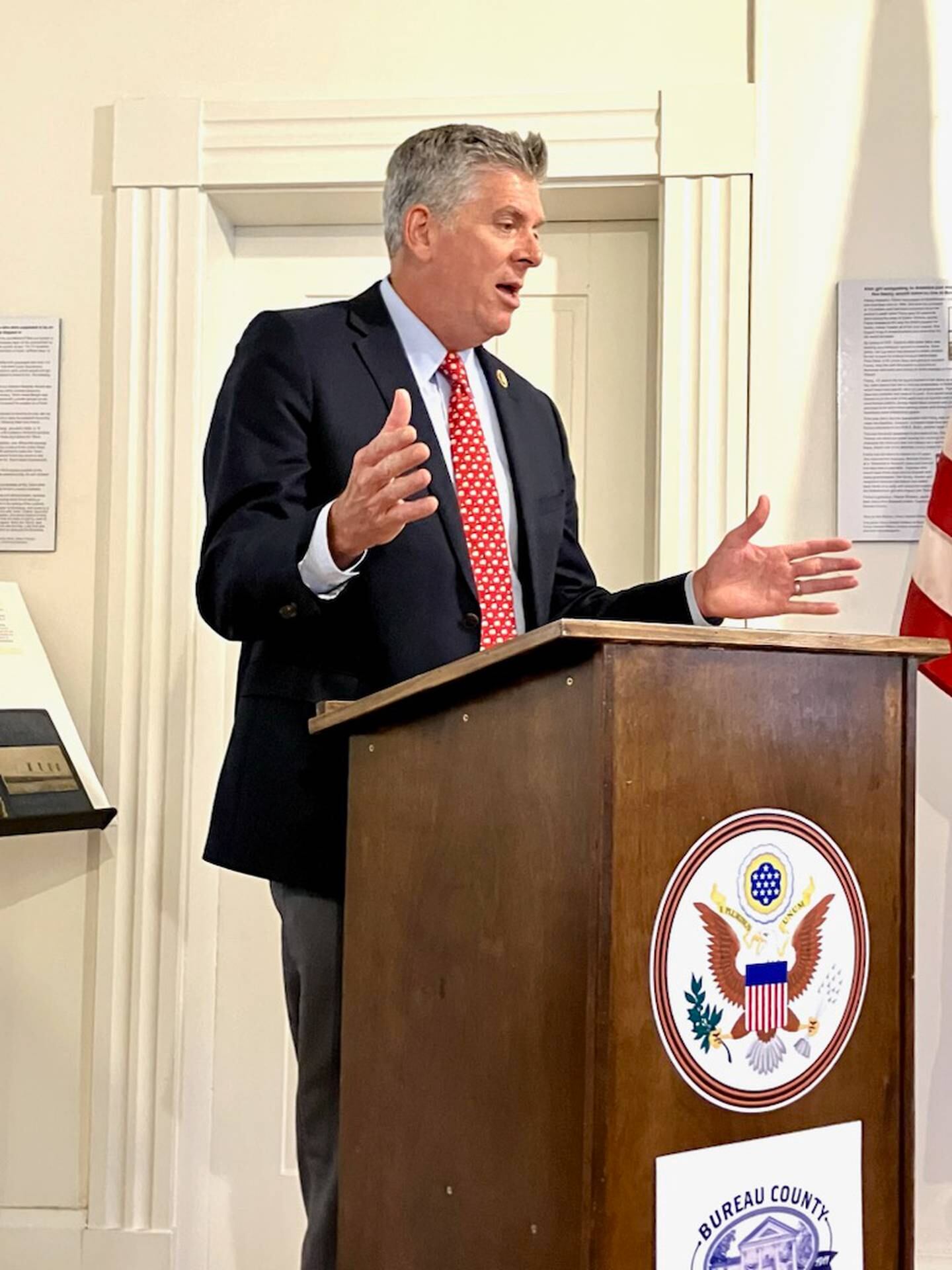 U.S. Rep. Darin LaHood speaks to Princeton city leaders and Bureau County History Center board members and staff during a visit Aug. 7, 2024, at the history center campus in Princeton.