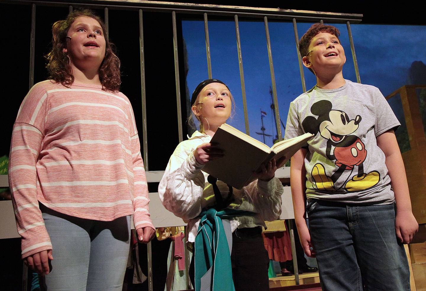 (Left to right); Woodlawn Arts Academy students Caitlyn Pink, Landon Camacho, and Cadence Howell performing in the academy’s fall musical theatre production of Disney’s “Pirates Past Noon Kids.”
