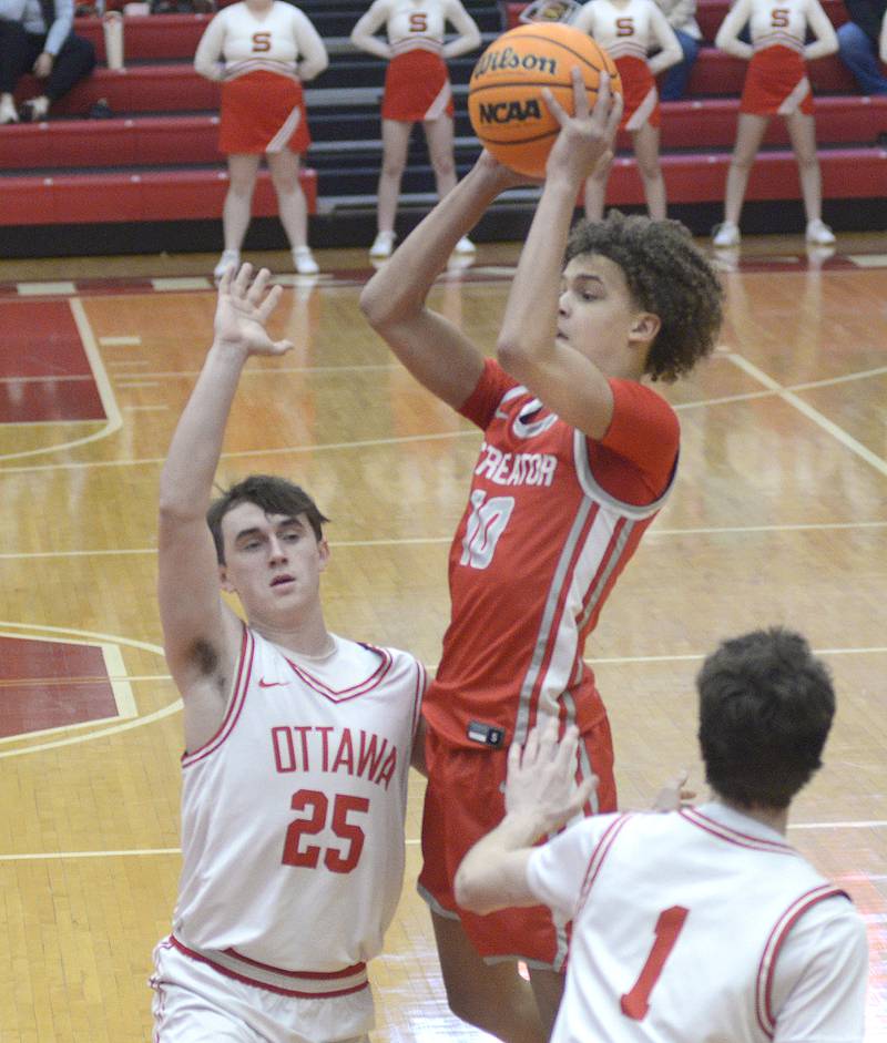 Streator’s Christian Bruton shoots over the block attempt by Ottawa’s Lucas Farabaugh in the 1st period Saturday at Ottawa.