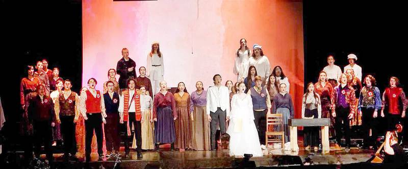 The cast of  "Les Miserabels" acts out a scene in Matthiessen Memorial Auditorium at La Salle-Peru Township High School.