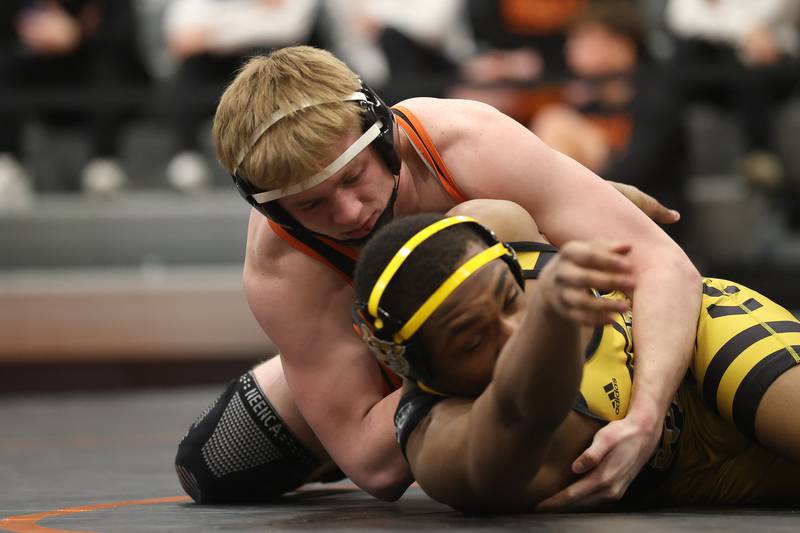 Minooka’s Kaden Meyer wraps up Joliet West’s Aiden Brown in the SouthWest Prairie Conference 165 pound championship on Saturday, Jan. 24, 2026 in Minooka.