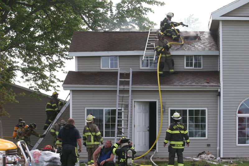 Tonica, Peru, Utica, Grand Ridge, Leonore and Oglesby fire departments work the scene of a structure fire in the 1900 block of East 8th Road on Wednesday, May 8, 2024 near Tonica. The fire happened just before 3:30p.m. A MABAS box alarm was issued.