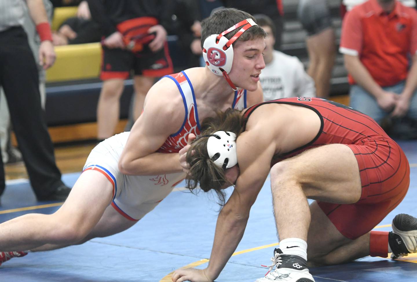 Oregon's Grant Stender (left) pushes Erie's Jase Grunder at the start of the 152-pound championship at the Polo Wrestling Invitational on Saturday. Gunder won the match.