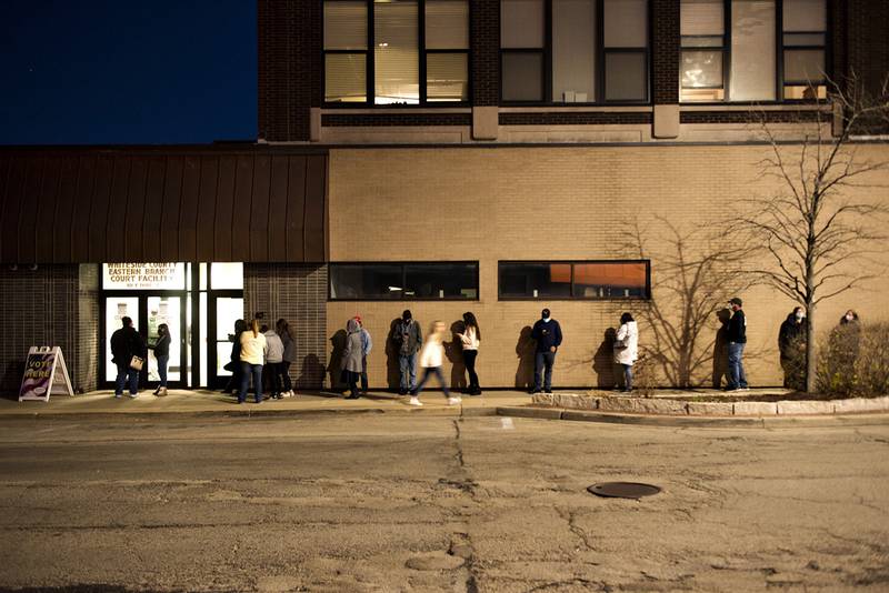 Voters line up outside of the Whiteside County Courthouse in Sterling Tuesday evening, waiting to vote in the general election.