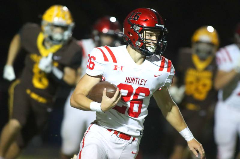 Huntley’s Chase Hojnacki runs the ball in varsity football at Jacobs High School in Algonquin on Friday, Sept. 26, 2025.