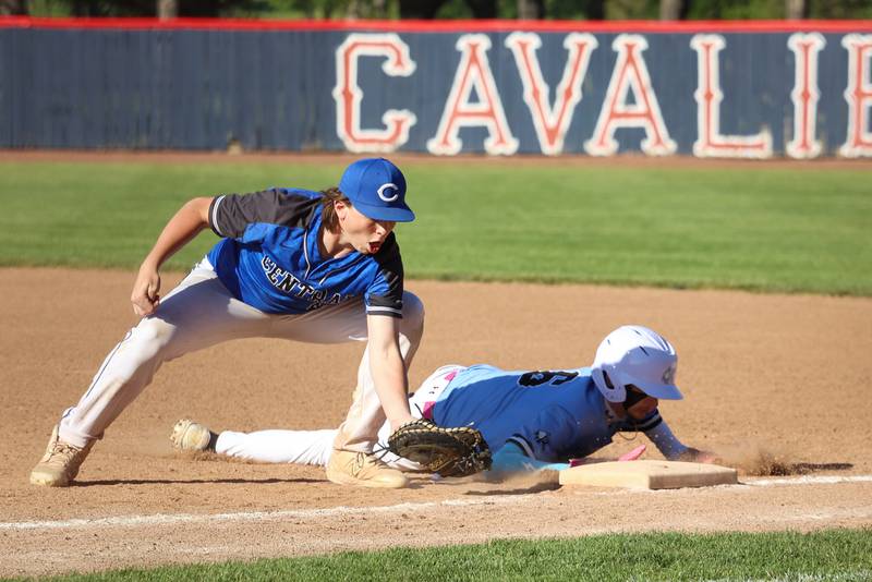 Kankakee's Bentley Deany dives back to first base ahead of the tag by Clifton Central's Brayden Meents during Central's 8-4 victory over Kankakee on Monday, May 11, 2026.