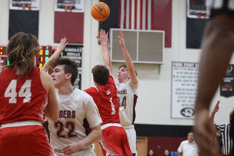 Plainfield North’s Quintin Wiencek puts up the contested deep shot against Naperville Central on Wednesday, Jan 22, 2025 in Plainfield.