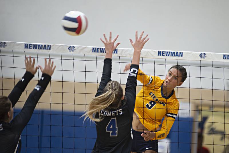 Sterling’s Grace Egan hammers a shot against Newman Thursday, Aug. 25, 2022.