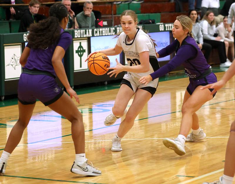 Kaneland's Samantha Kerry drives between two Dixon defenders during their Class 3A sectional semifinal game Tuesday, Feb. 25, 2025, at Boylan Catholic High School in Rockford.