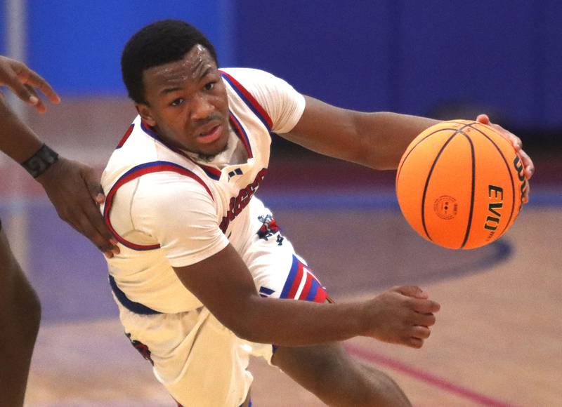 Dundee-Crown’s Kadin Malone moves the ball against Jacobs in varsity boys basketball on Friday, Dec. 12, 2025, at Dundee-Crown High School in Carpentersville.
