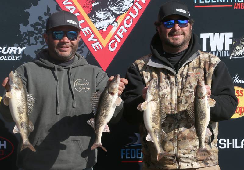 Joe Perez of Spring Valley and Michael Perez of Belleville Wis. hold up their Walleye and Sauger during the National Walleye Tour Masters Walleye Circuit on Saturday, March 23, 2024 in Spring Valley.