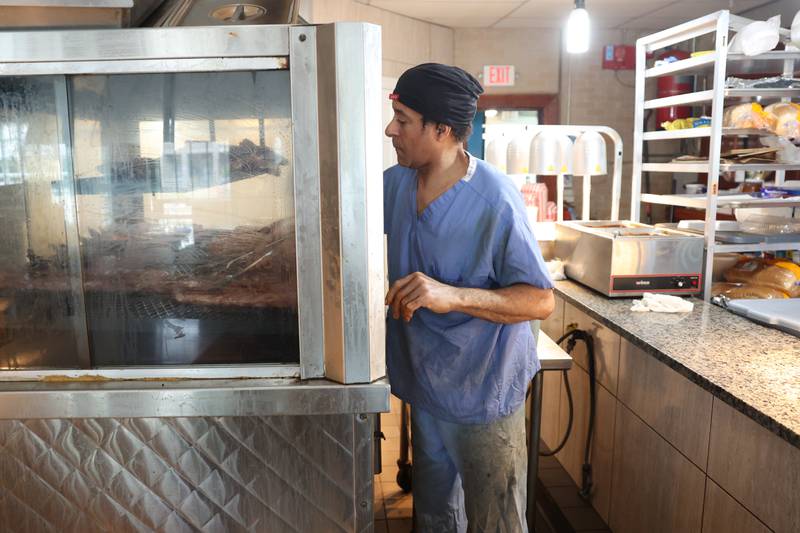 Kevin Roberts puts on more ribs for the lunch rush at Chicago Style BBQ on Wednesday, May 29, 2024 in Joliet.