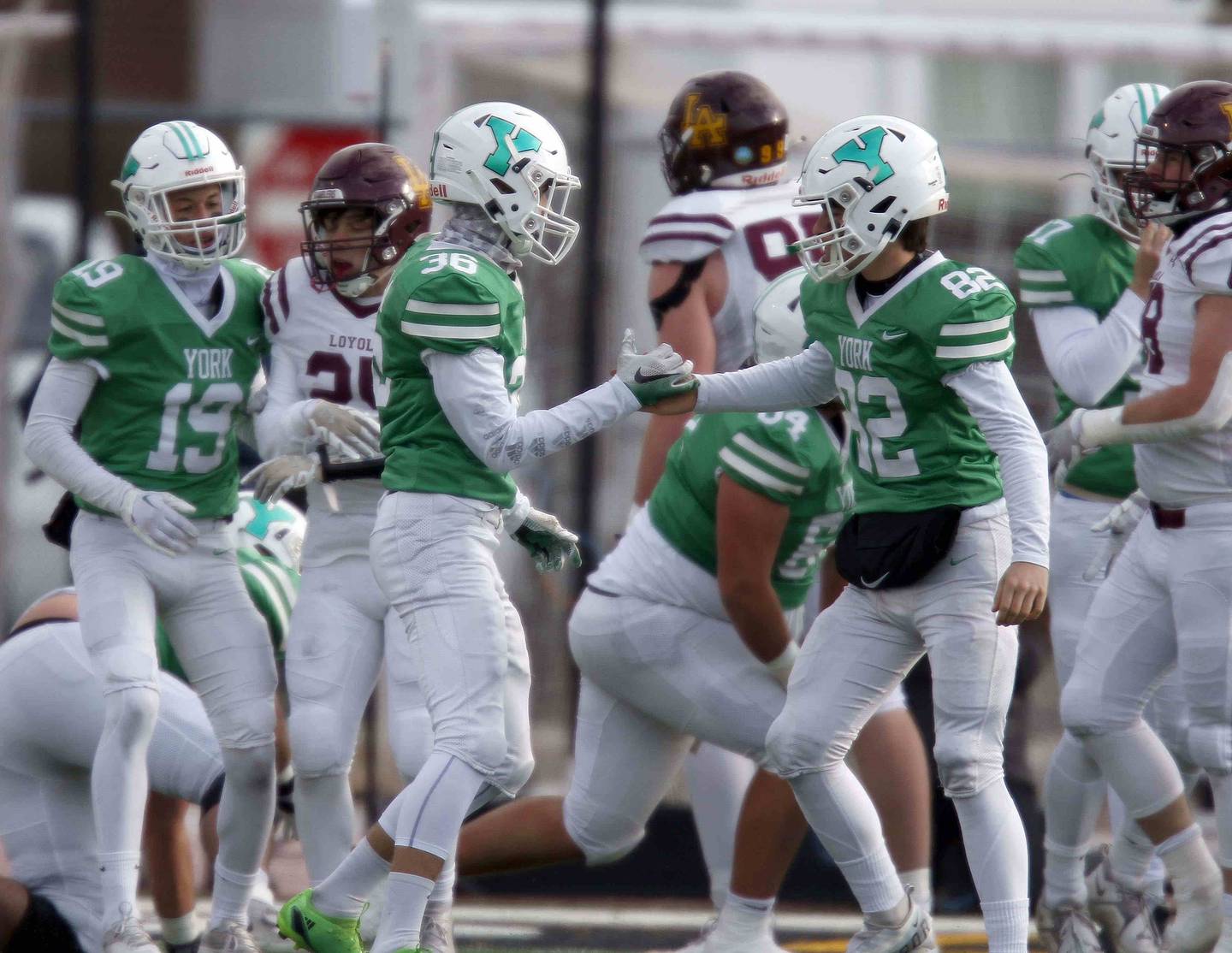 York’s Damian Glodz (36) and Nico Ruggieri (82) celebrate a field goal during the IHSA Class 8A semifinal football game Saturday November 19, 2022 in Elmhurst.