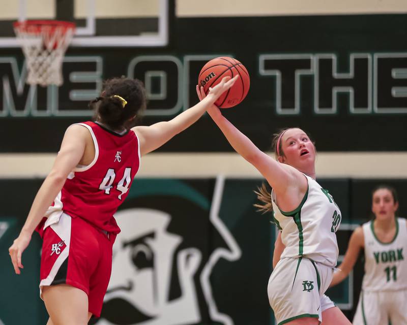 York's Hannah Meyers (20) intercepts a pass intended for Hinsdale Central's Ann Schaefer (44) during basketball game between Hinsdale Central at York. Dec 8, 2023.