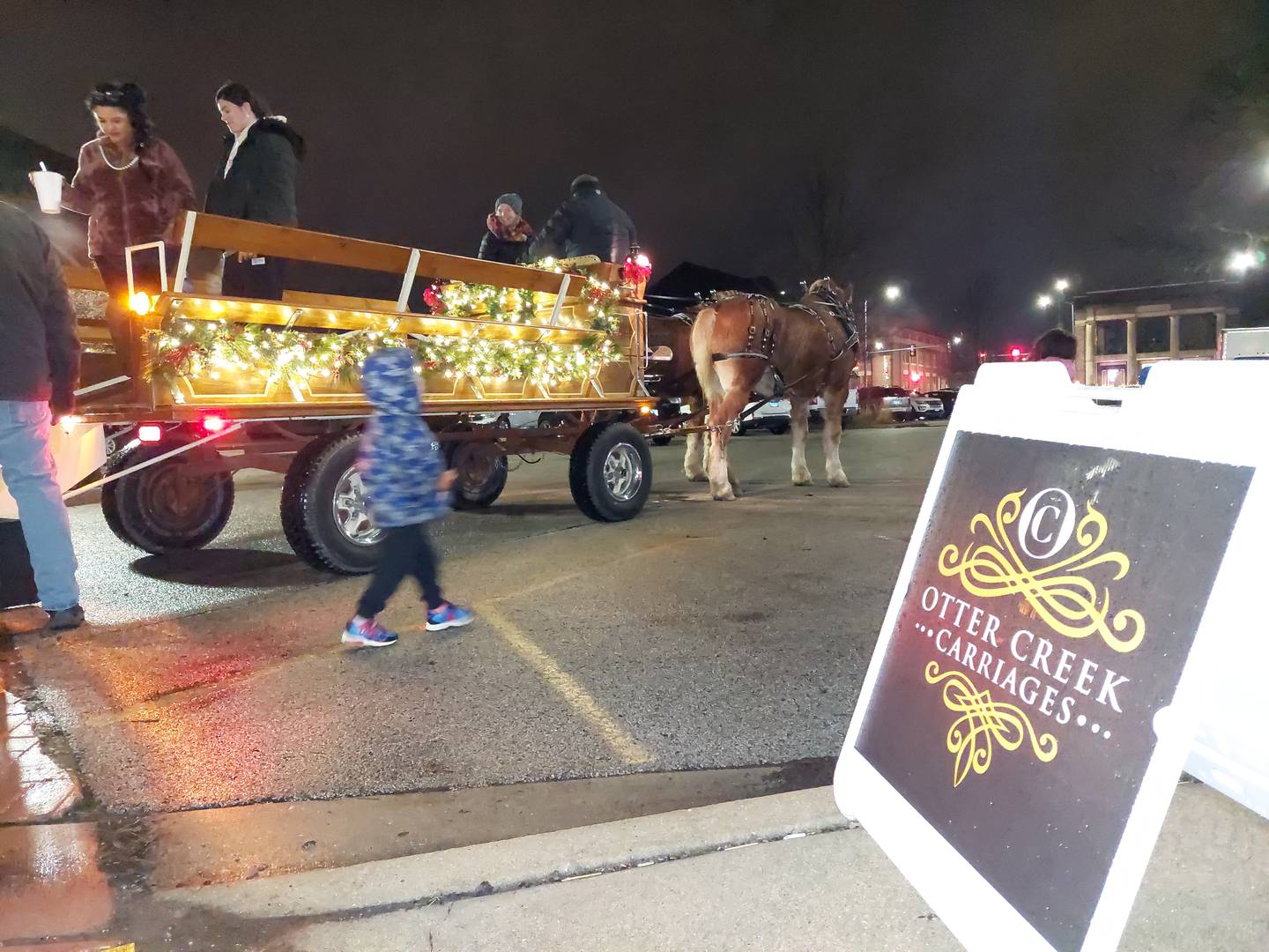 A horse drawn carriage provided visitors with rides Saturday, Dec. 16, 2023, around City Park during Light Up Streator's inaugural Christmas in the Park event.