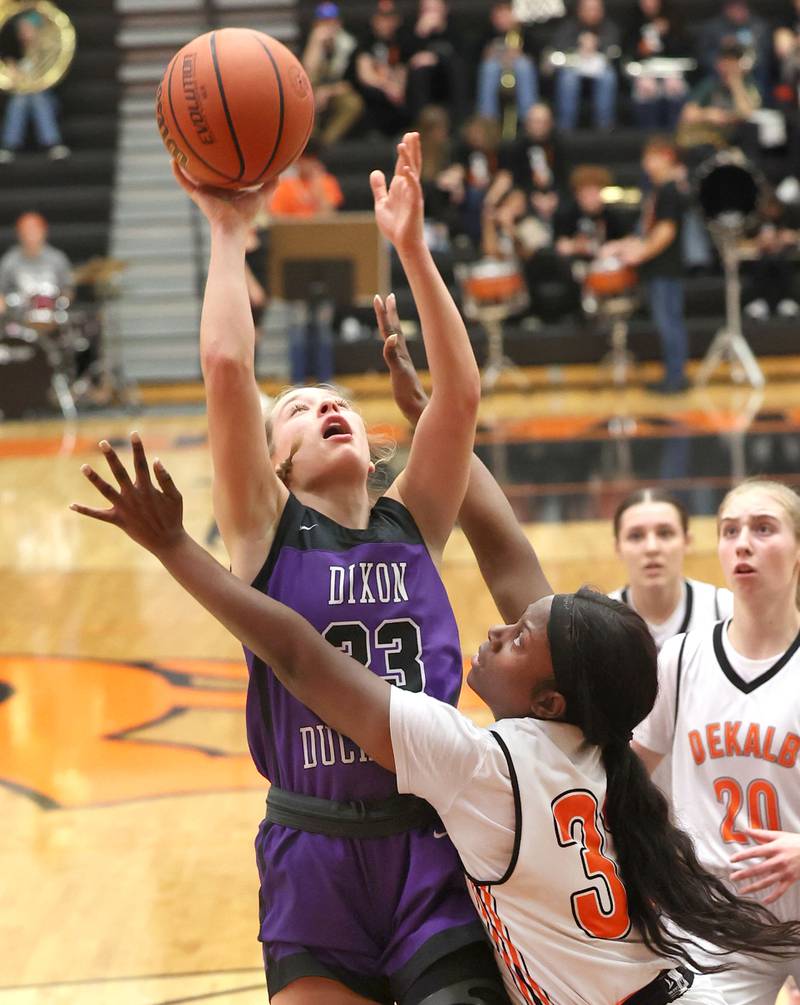 Dixon’s Hannah Steinmeyer shoots over DeKalb's Cayla Evans during their game Monday, Jan. 23, 2023, at DeKalb High School.