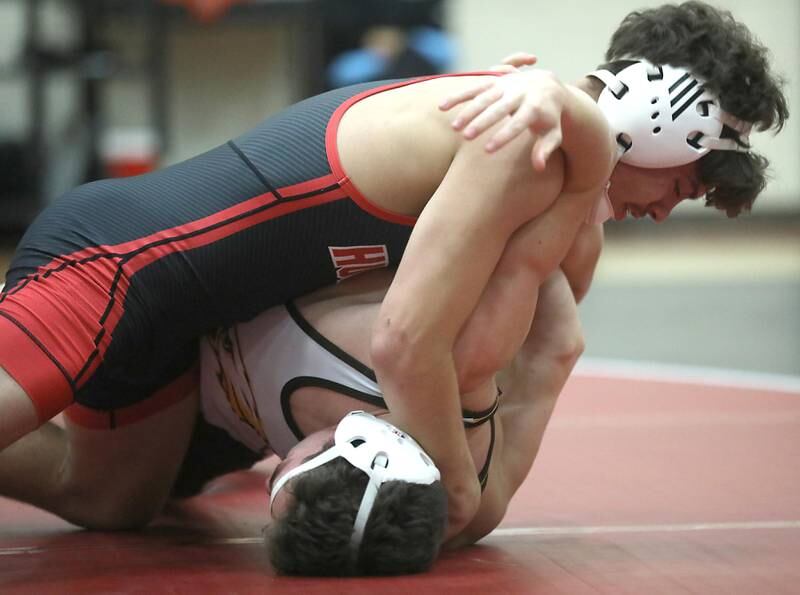 Huntley’s Gavin Nischke tries to pin Jacobs’ Asher Bonilla during the 150—pound match of a Fox Valley Conference wrestling meet on Thursday, Dec. 11, 2025, at Huntley High School.