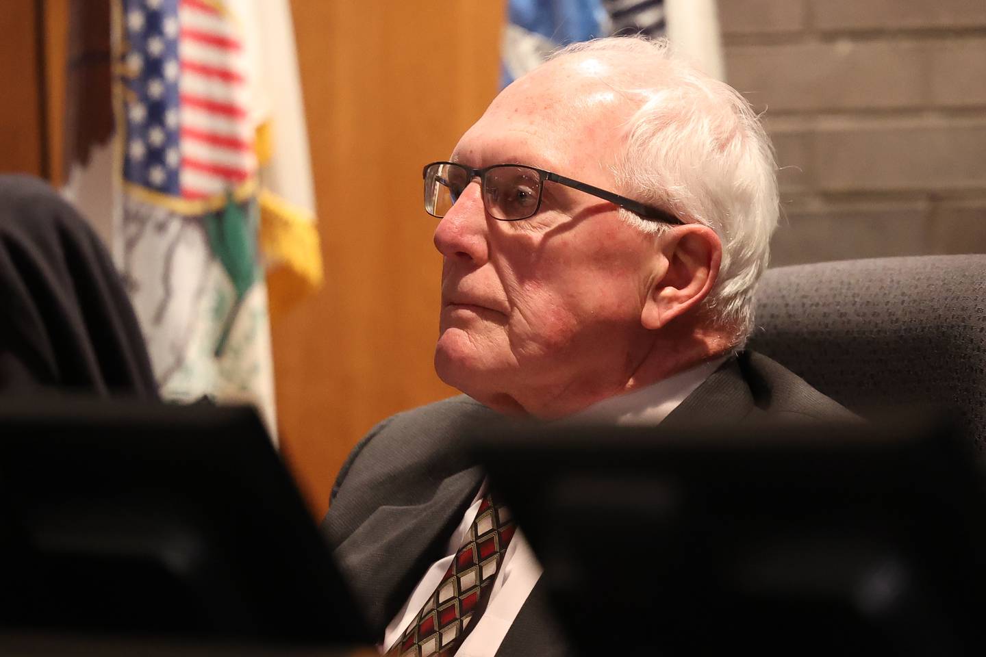 Council Member Pat Mudron listens to Inspector General Sean Connolly speak on the conspiracy allegations against Joliet Mayor Bob O’DeKirk during the City Council Meeting at City Hall in Joliet on Monday, March 13th, 2023.