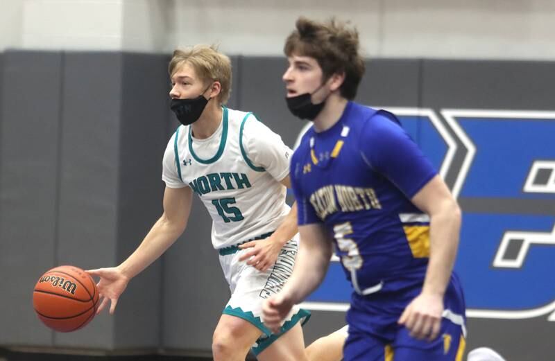 Woodstock North’s Gabe Filetti moves the ball against Wheaton North during MLK Tournament action at Burlington Central High School Saturday morning.