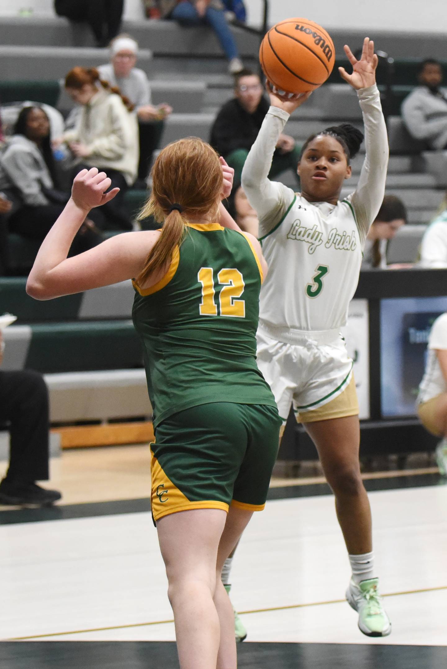 Bishop McNamara's Eliana Isom, right, takes a shot as Coal City's Jori Tucker defends during a game at Bishop McNamara Tuesday, Nov. 25, 2025.