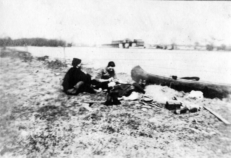 Ernest Hemingway and an unidentified boy, probably Ray "Cohen" Ohlsen, camp on the shore during a canoe trip from Oak Park to Starved Rock, Illinois down the Illinois and Michigan Canal.
